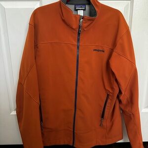 Patagonia Orange Performance Jacket with Minimalist Design